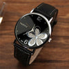 YAZOLE Ladies OL Style Four-leaf Clover Pattern Quartz Watch(338 black plate silver flower brown belt )