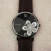 YAZOLE Ladies OL Style Four-leaf Clover Pattern Quartz Watch(338 black plate silver flower brown belt )